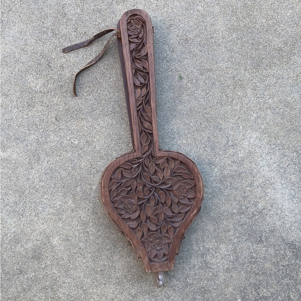 Old decorative hand carved wood wooden and leather fireplace bellows